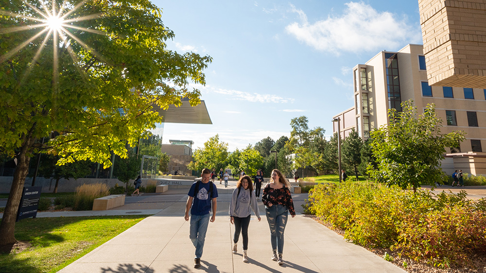 Three students walking on Colorado of School Mines cmapus